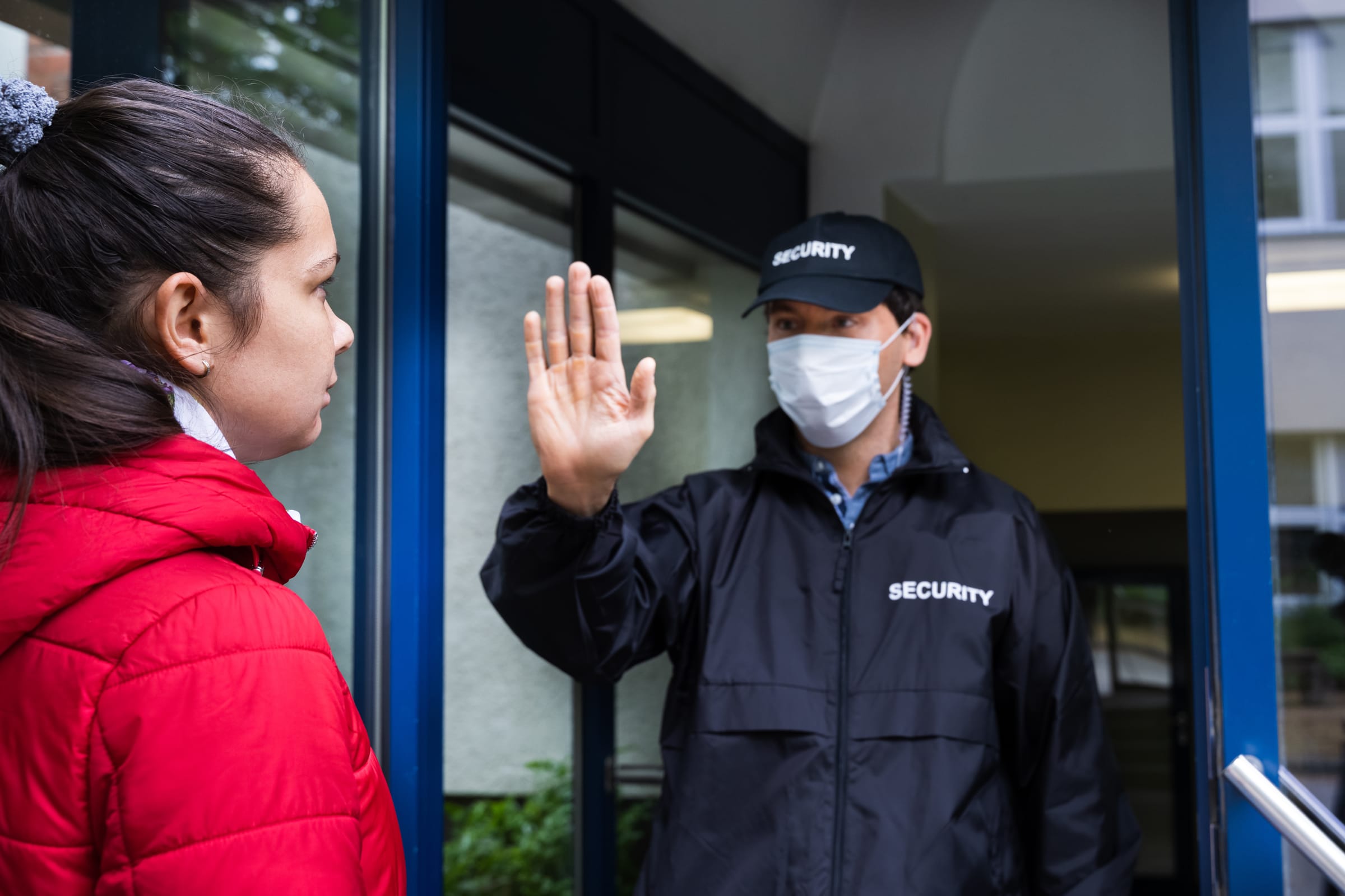 Hospital security guard assisting with visitor access