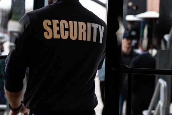 Security operator monitoring alarm events and escalation workflows